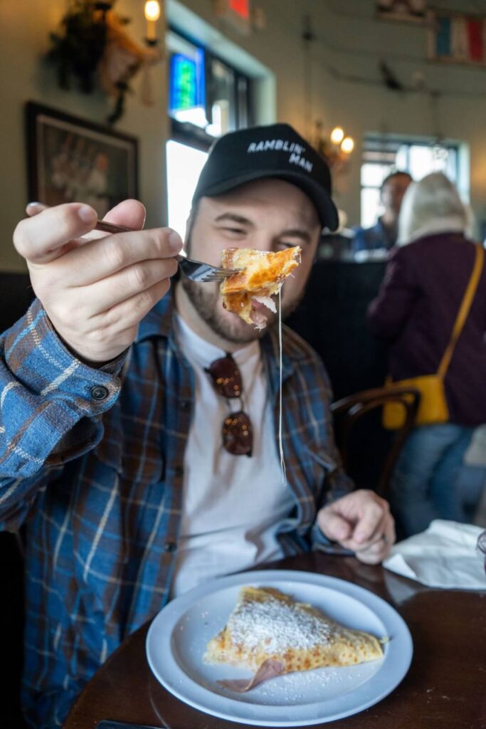 A gooey, dripping bite of a savory crepe at French Market Creperie