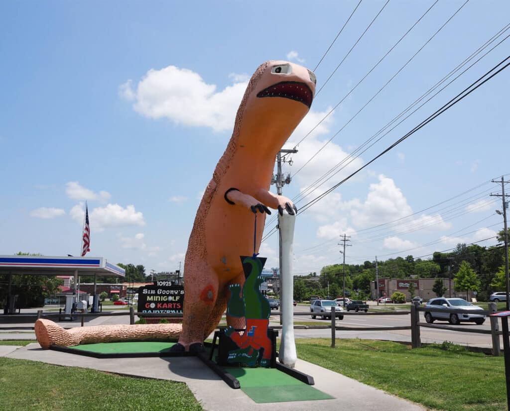 A large orange dinosaur sculpture at Sir Goony's, a kid-friendly recreational park near Farragut.